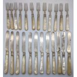 A collection of silver and mother of pearl knives and forks, 12 pairs, all blades hallmarked