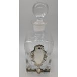 An Israeli glass decanter with silver banding and a vacant silver cartouche, H.26cm