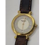 A Raymond Weil 18ct gold plated ladies wristwatch, quartz motion, brown leather strap, D.2.5cm