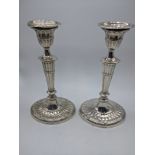 A pair of Edwardian silver candlesticks, hallmarked Birmingham, 1904, 605g, filled, H.21cm