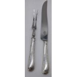 A Mappin & Webb silver handled carving knife, L.36.5cm, and fork, L.28cm, hallmarked Sheffield,