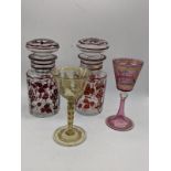 A collection of Bohemian-style glassware to include two glass jars with vine patterns, H.175cm, a