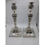 A pair of George III silver candlesticks, hallmarked Sheffield, 1776, 1365g, filled, H.29cm