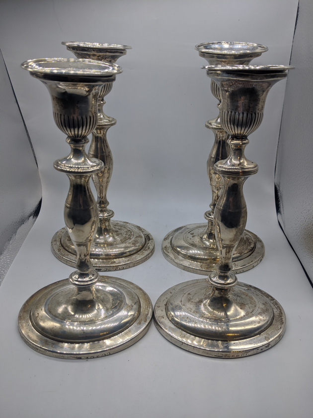 A set of 4 George III silver candlesticks, hallmarked Sheffield, 1817, maker Alexander Goodman,