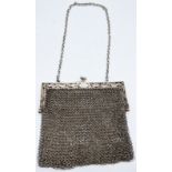 A late 19th/early 20th century Chinese export silver mesh handbag, decorated with stylised