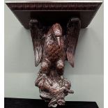 A 19th century oak carved wall sconce in the form of an eagle, H.55cm W.48cm