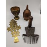 Four Islamic brass items to include a North African carpet making comb, a cup and a sprinkler