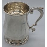 A George II silver tankard, London hallmarks, possibly 1750, maker possibly J.W., 290g, H.12cm