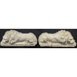 A pair of early 20th century white ceramic lions