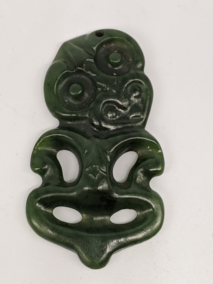 An early 20th century New Zealand Maori Hei-Tiki nephrite pendant, H.6cm W.3.5cm - Image 2 of 3