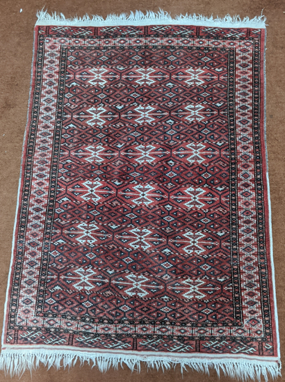 A red ground Afghan rug, 156cm x 112cm