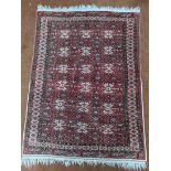 A red ground Afghan rug, 156cm x 112cm