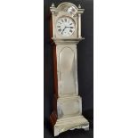 A large Victorian silver fronted goliath pocket watch holder in the form of a longcase clock,