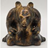 A Chinese bronze bear incense burner coated in a gold colour wash, pigment to the tongue and