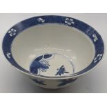 A Chinese early 20th century blue and white bowl, decorated with crane birds, splays and lotus,