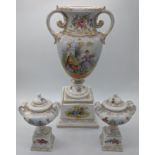 A German porcelain urn together with a pair of smaller similar urns, H.28.5cm