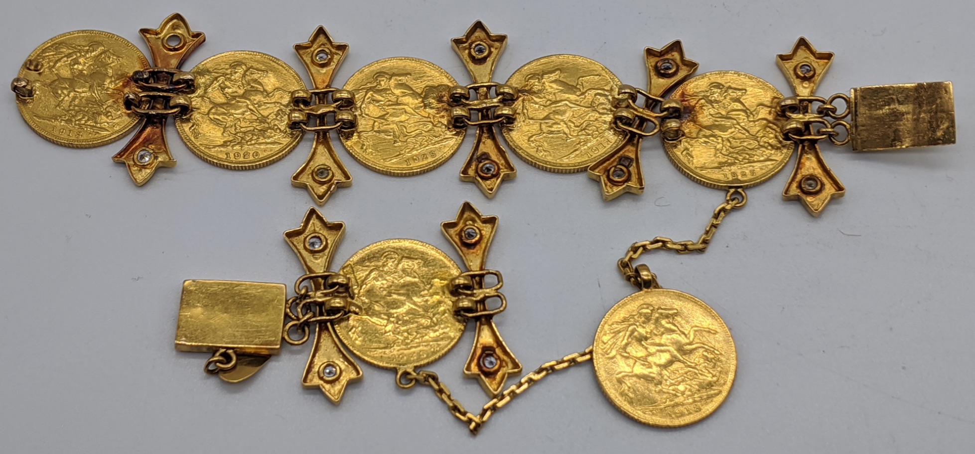 A gold and diamond bracelet mounted with 7 full sovereign coins, the links are unmarked but test as - Image 2 of 2