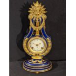 A Franklin Mint model of a Louis XVI style Marie Antionette clock, V&A issue, with key