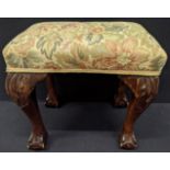 A Georgian mahogany footstool, claw and ball feet, floral embroidered upholstery, H.37cm L.38cm D.