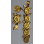 A gold and diamond bracelet mounted with 7 full sovereign coins, the links are unmarked but test as