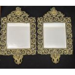 A pair of brass wall mirrors, bevelled plate glass, H.68cm W.42cm