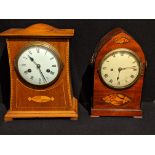 In the manner of Charles Voysey, an Arts and Crafts oak inlaid mantel clock, domed top, 8 days