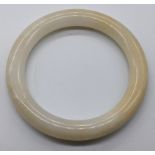 A Chinese white jade bangle, D.7.5cm