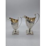 A George III silver cream jug by Henry Chawner, hallmarked London, monogrammed, H.13.5cm, together