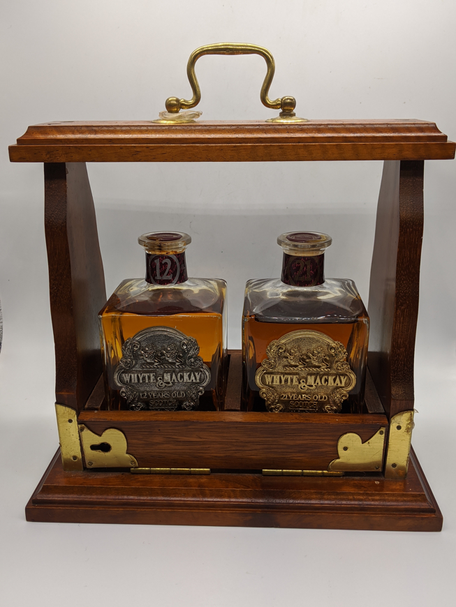 Two White & Mackay half bottles of whiskey, a 21 year old and a 12 year old (2 x 37.5cl), within