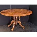 A Victorian walnut inlaid dining table, H.73cm L.91cm