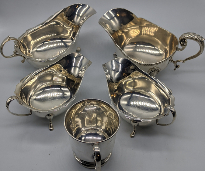 A collection of 20th century silver tableware to include a pair of sauceboats, 2 other sauceboats