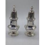 A pair of large 20th century silver sugar sifters, hallmarked London, 1965, 475g, H.10.5cm