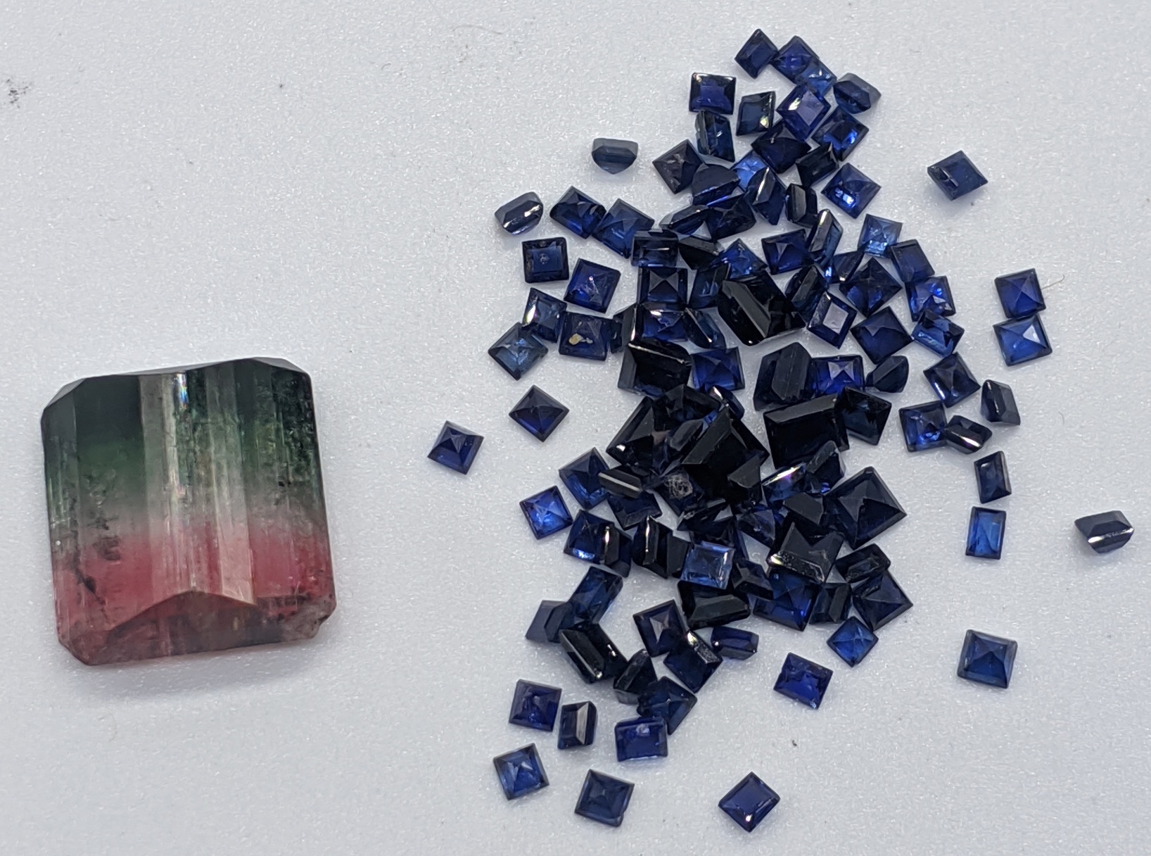 A collection of loose sapphires, together with one other gem stone