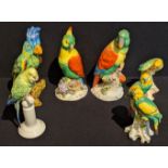 A collection of porcelain parrots