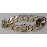 A 9ct gold curb chain bracelet, patterned to one side, marks to clasp area, 48g, width of chain 1.