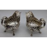 A pair of George III silver sauce boats, embossed bodies with pie crust edge, hallmarked London,