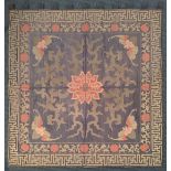A 19th century Chinese silk wall hanging, blue ground with a Wan pattern border, a central motifs