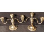 A pair of Westmorland sterling silver twin branch candlesticks, filled bases, H.19cm (A/F)