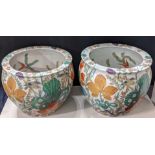 A near pair of large Chinese jardiniere, early 20th century, decorated with fish and floral designs,