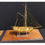 A model of a ship within perspex case, case size 77.5cm x 77cm