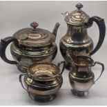 A silver tea set comprising of a teapot, waterpot, milk jug and sugar sifter, hallmarked Birmingham,
