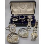 A collection of silver tableware to include, shell dishes, pepperettes, salts, various hallmarks