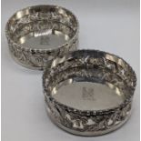 A pair of George III silver coasters, decoration with Anthemion and Acanthus leaves, both hallmarked