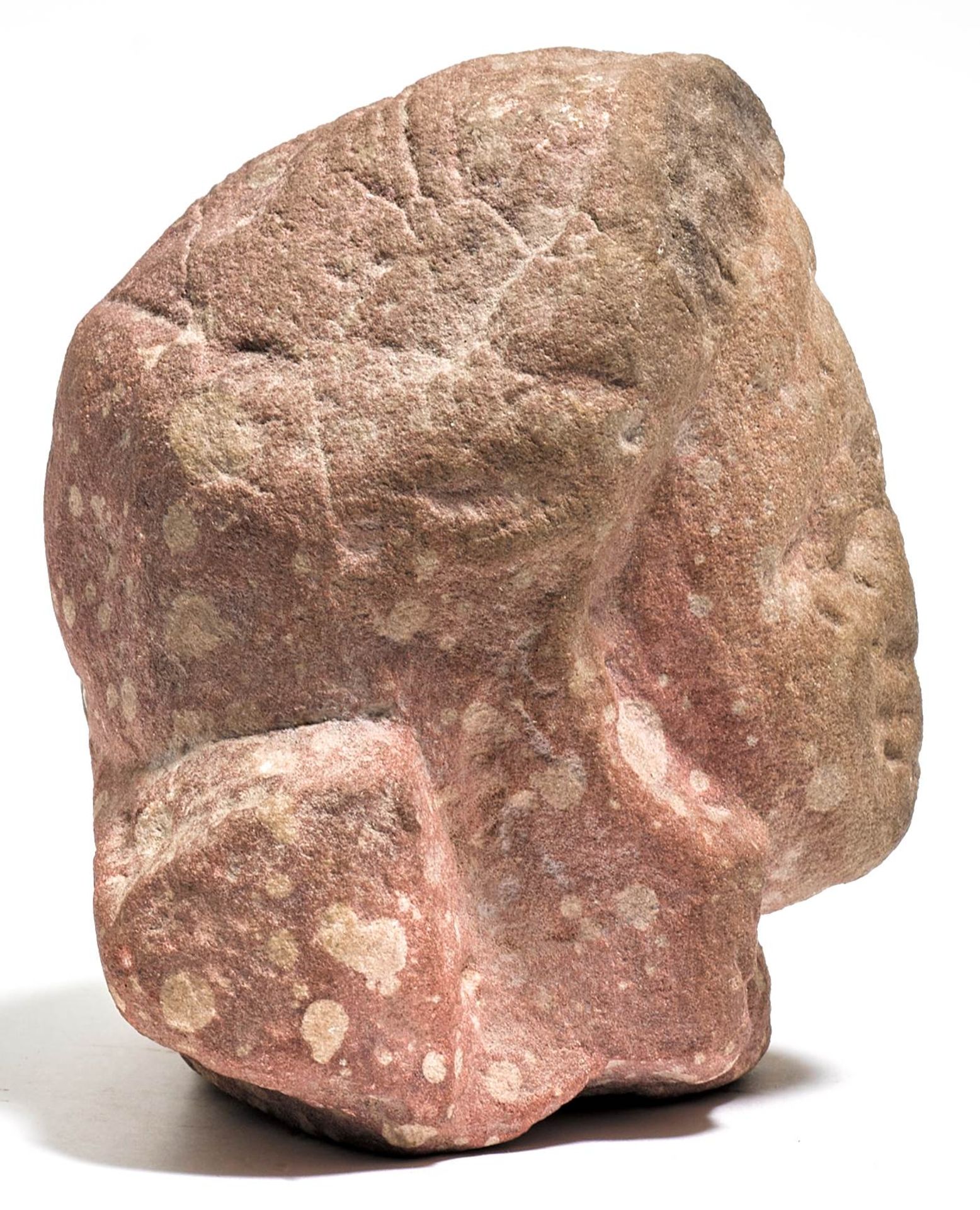 A SMALL MOTTLED RED SANDSTONE HEAD. - Image 3 of 5