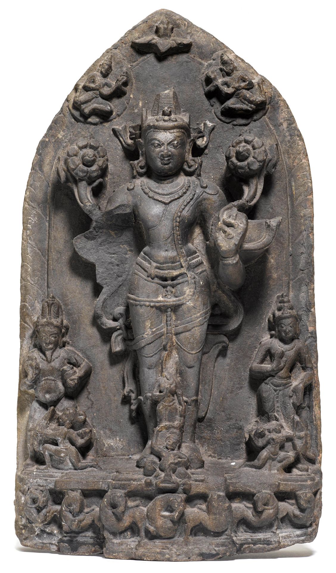 A BLACK STONE STELE OF SURYA.