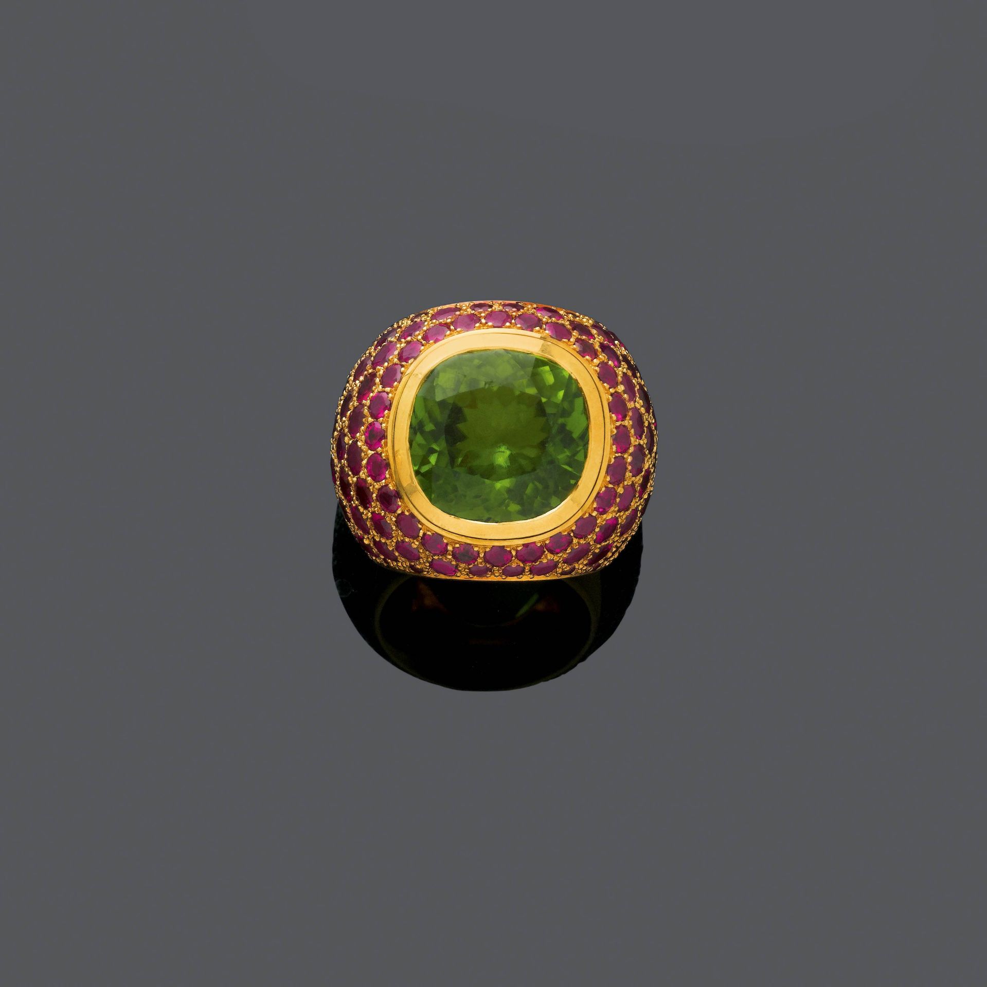 PERIDOT, RUBY AND GOLD RING, BY MAJO FRUITHOF.