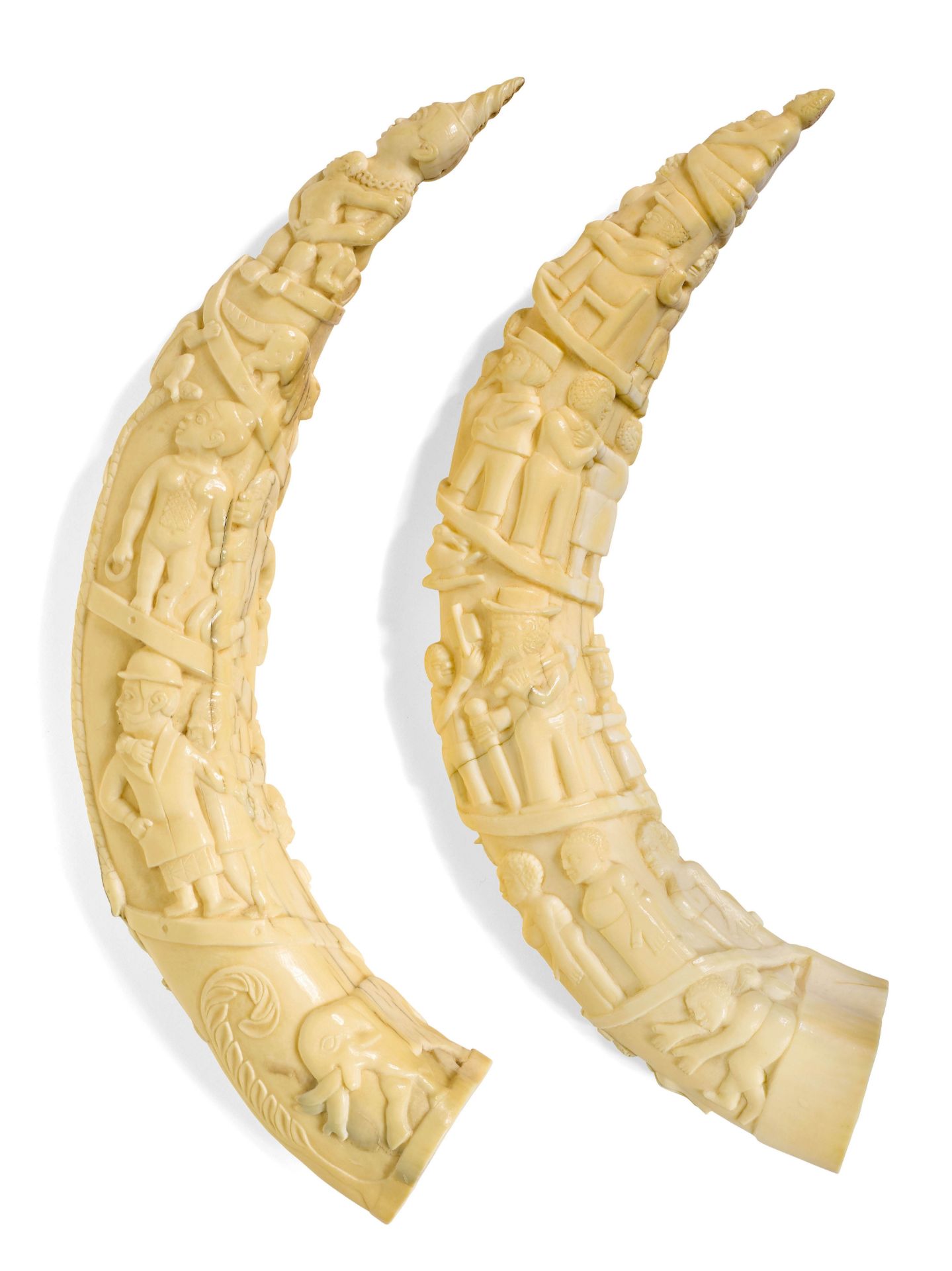 TWO CARVED HIPPOPOTAMUS TUSKS