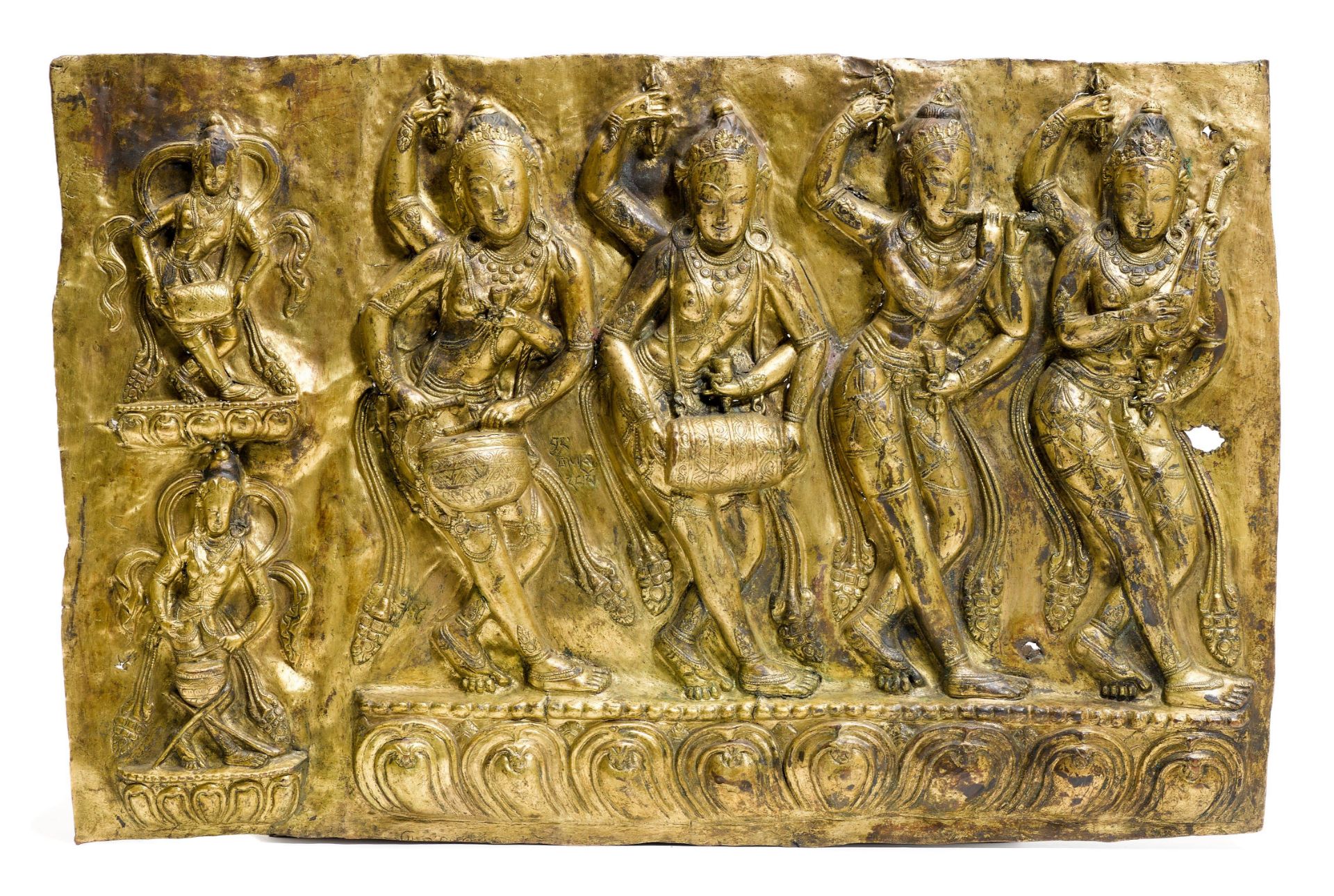 A GILT COPPER REPOUSSE FRIEZE.