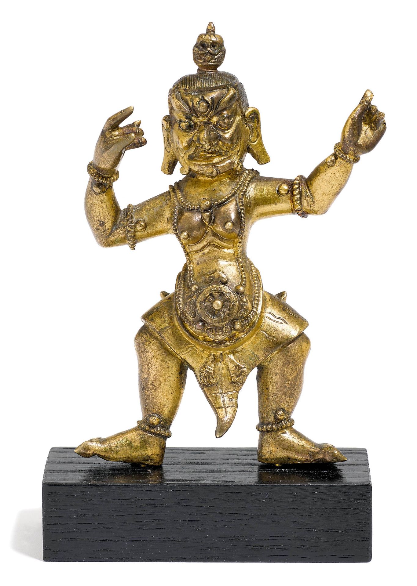 A GILT BRONZE FIGURE OF A FEMALE WRATHFUL DEITY.