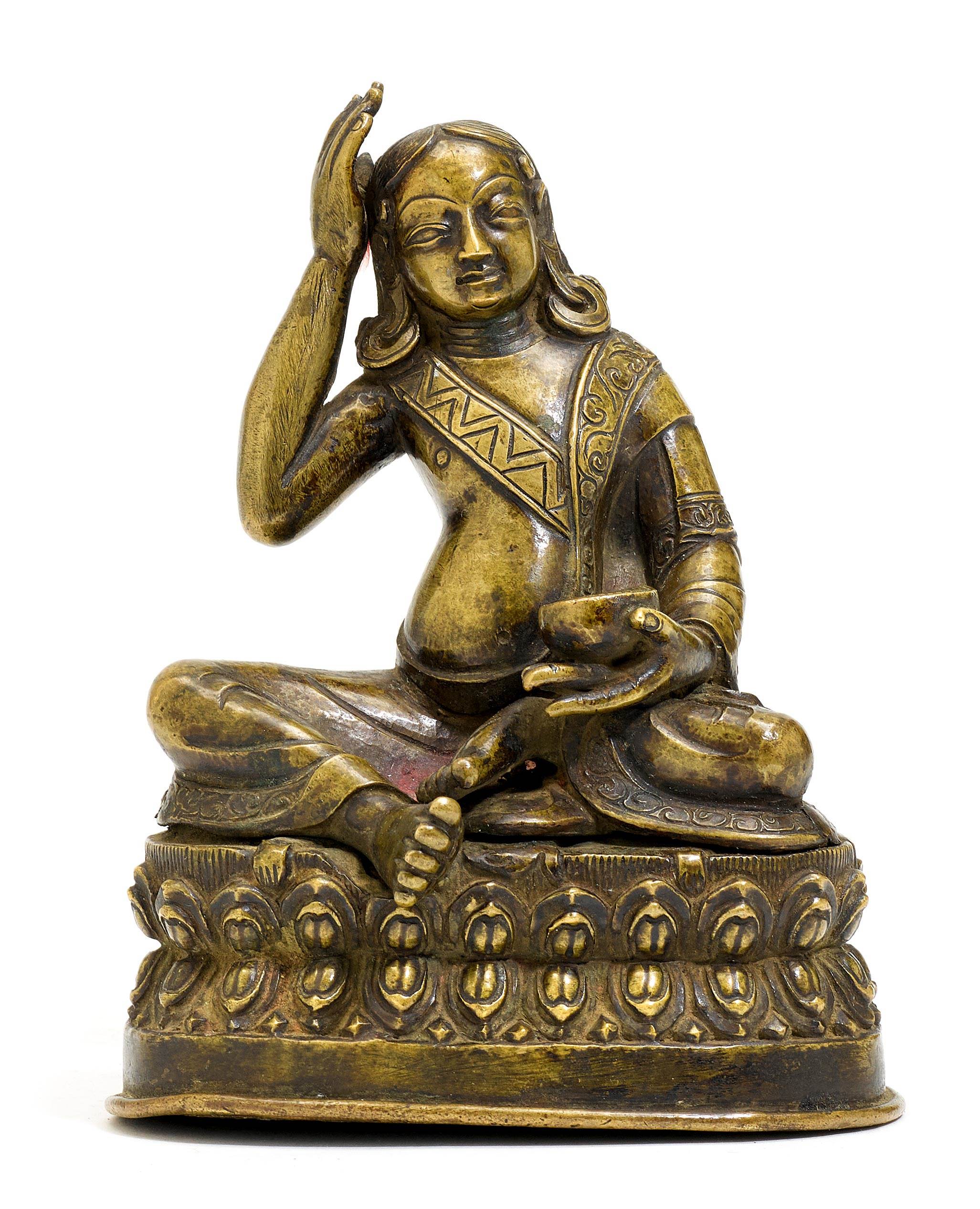 A BRONZE FIGURE OF MILAREPA.